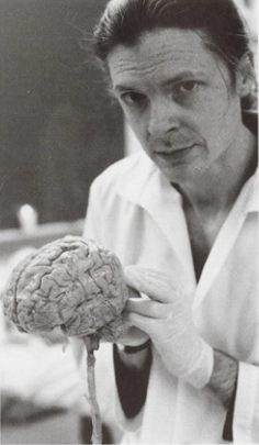 Alex Grey, holding a brain.